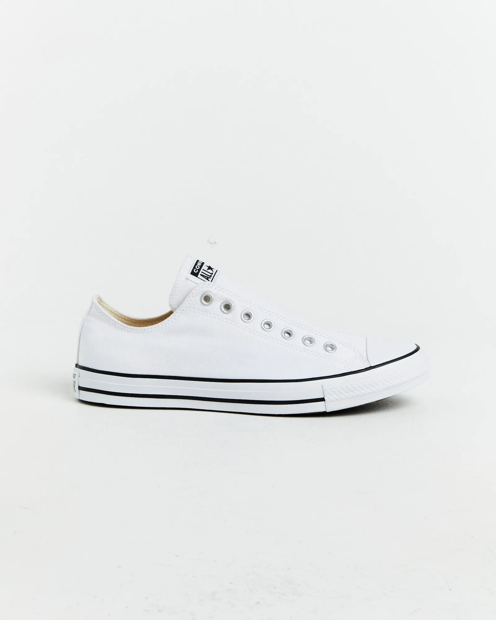 Chuck Taylor All Star Slip On Sneakers In White/Black